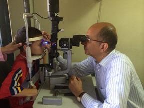 Dr Khalil examining a child who had congental glaucoma operations before at the Glaucoma Service he is operating in the Cairo Research Institute of Ophthalmology